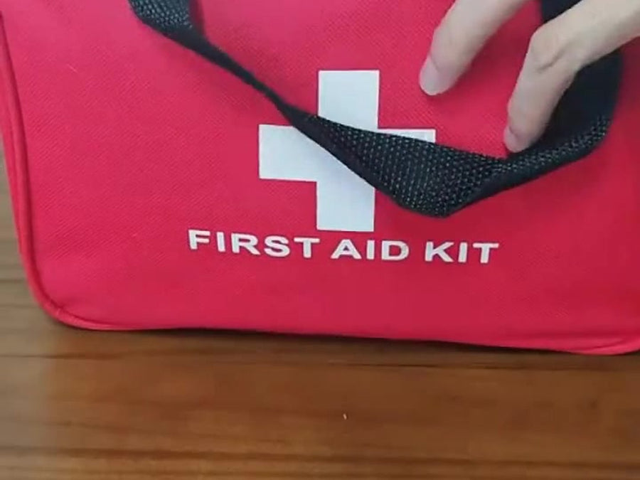 Red water-resistant first aid bag with zipper