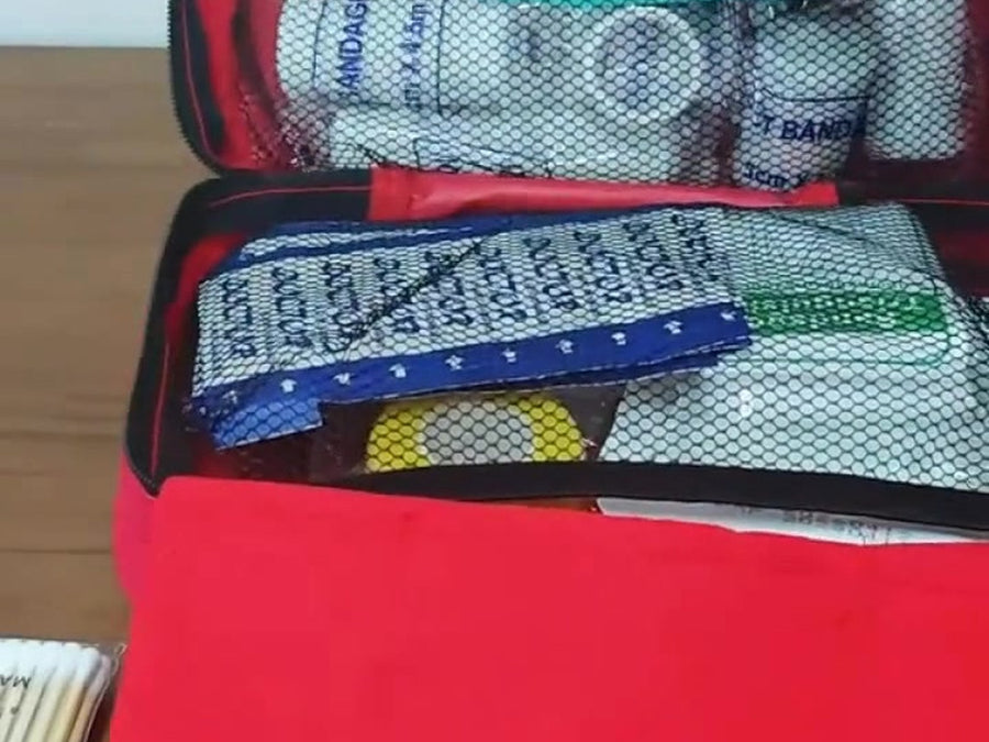 Clear inner pockets holding bandages and gauze