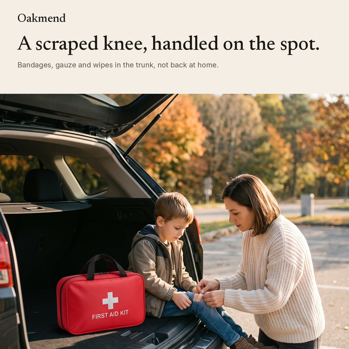 Parent treating a child's scraped knee with the first aid kit at the car trunk