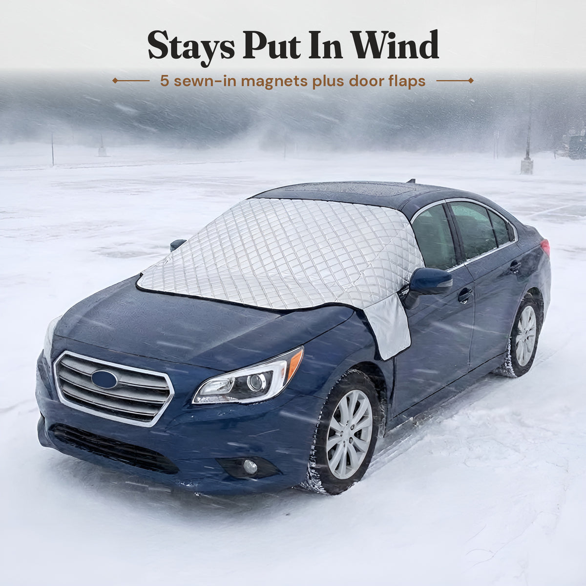 Windshield cover staying in place on a car in a snowstorm